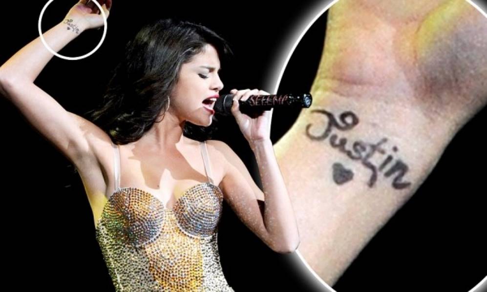 7. Selena Gomez's "G" finger tattoo - wide 4
